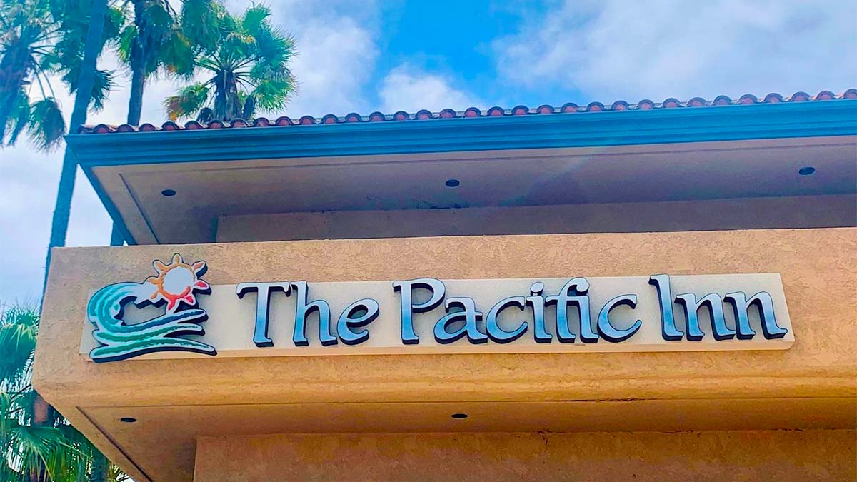 The front view of the building where the signage of the inn, The Pacific Inn, was displayedÂ